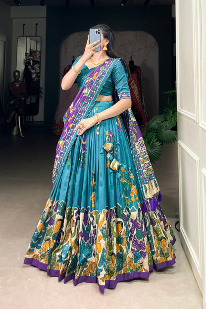 Blue Tussar silk lehenga with Kalamkari print work, featuring artistic patterns that add a graceful touch to festive wear.
