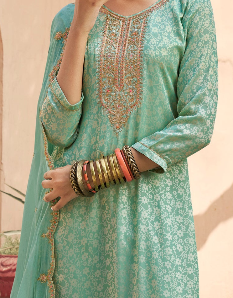 Stylish Silk Designer Salwar Kameez with rich embroidery, ideal for wedding wear.