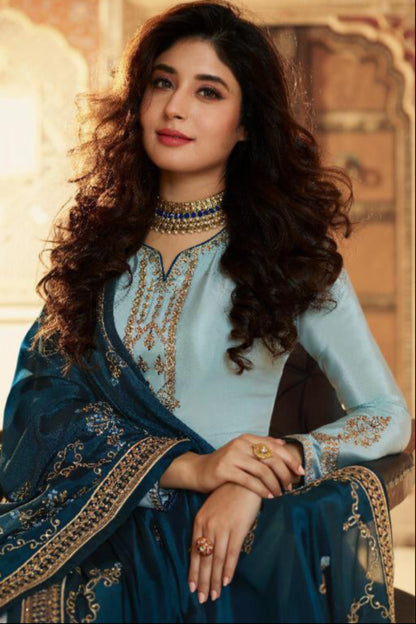 Plus-Size Woman Wearing an Elegant Blue Embroidered salwar Kameez Matching Palazzo Suit.