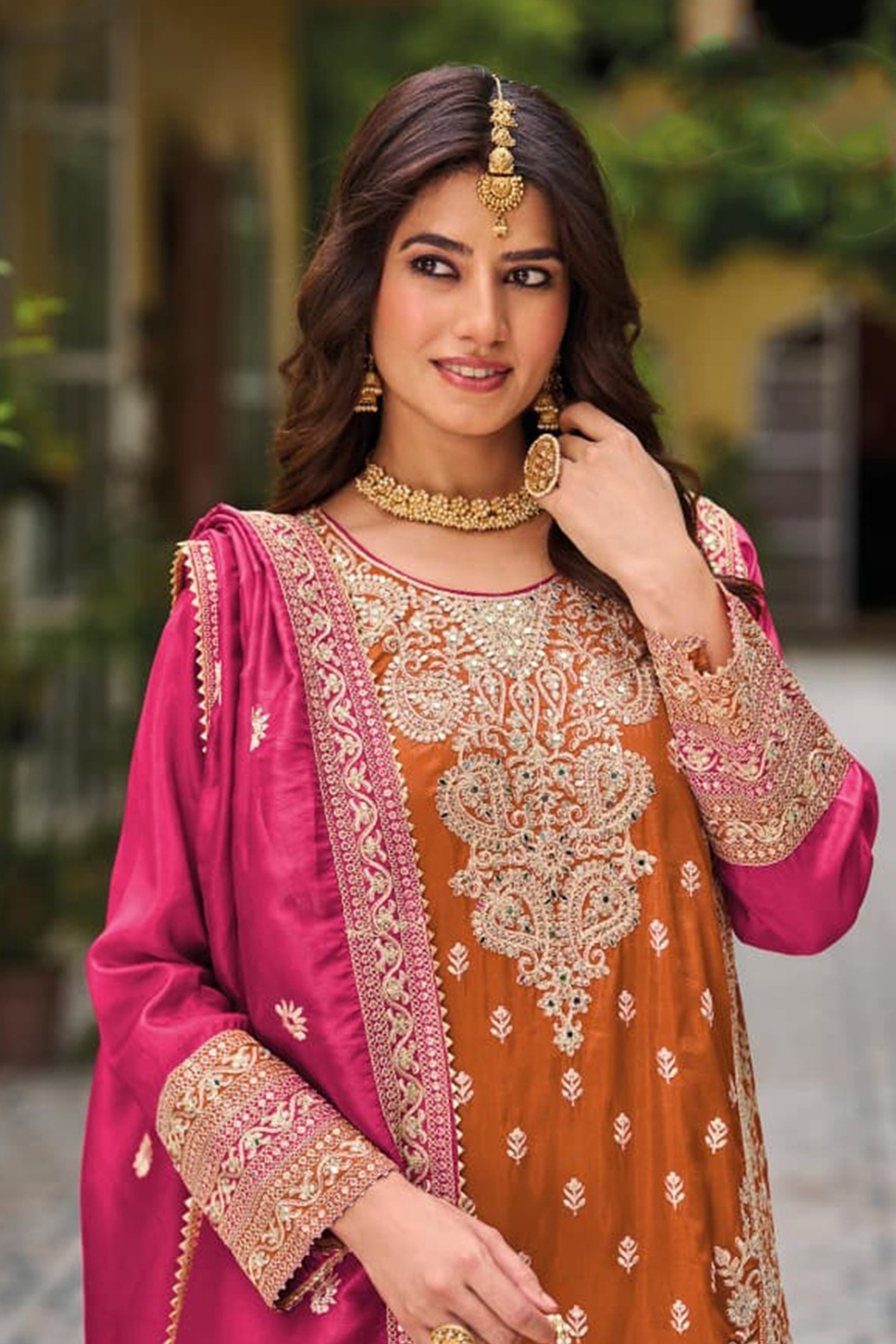 Close-Up Of Sequin Embroidery Work On Orange Pakistani Salwar Kameez Palazzo Suit