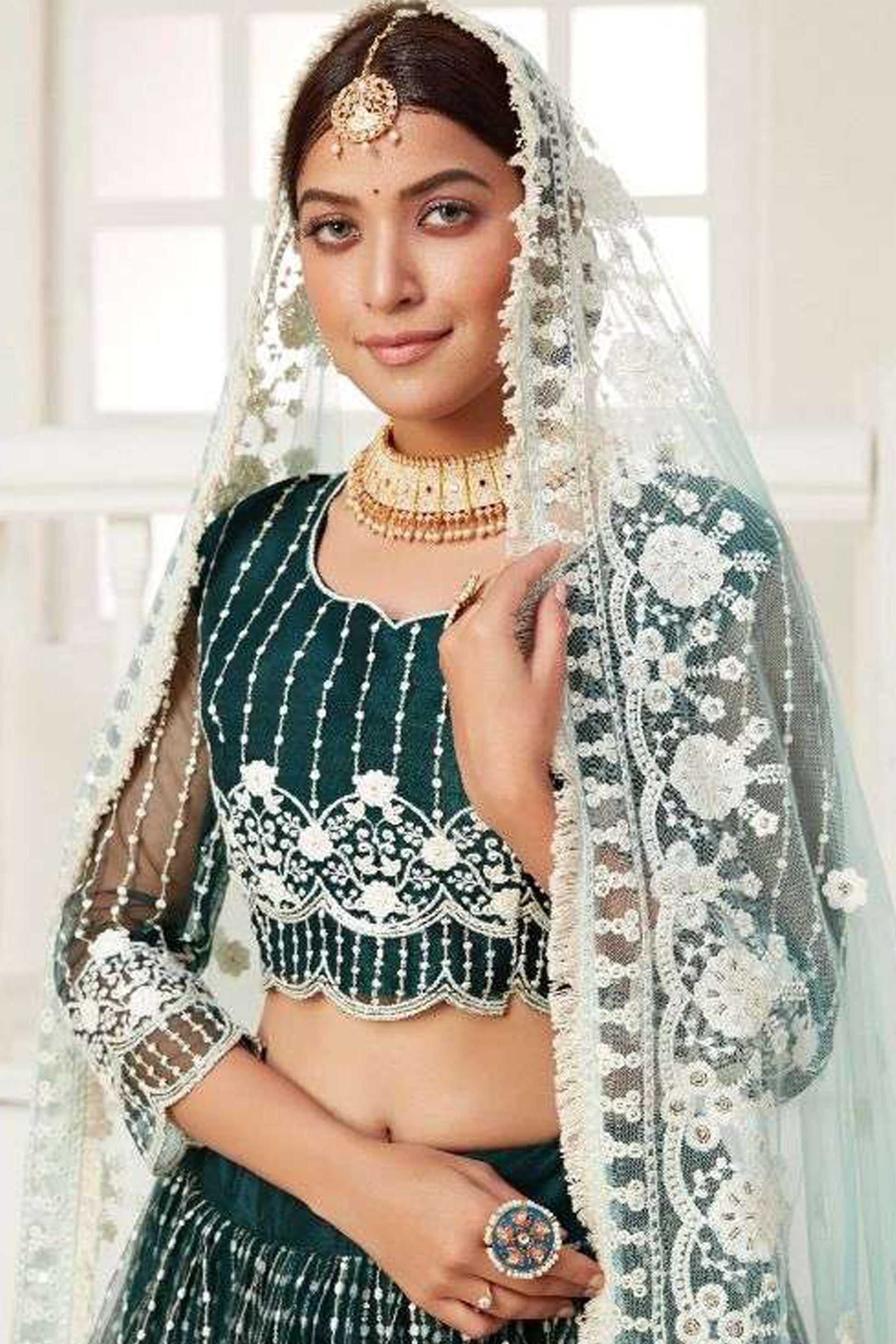 Traditional Dark Green Wedding Lehenga With Dupatta Showing Full Outfit Draping Style