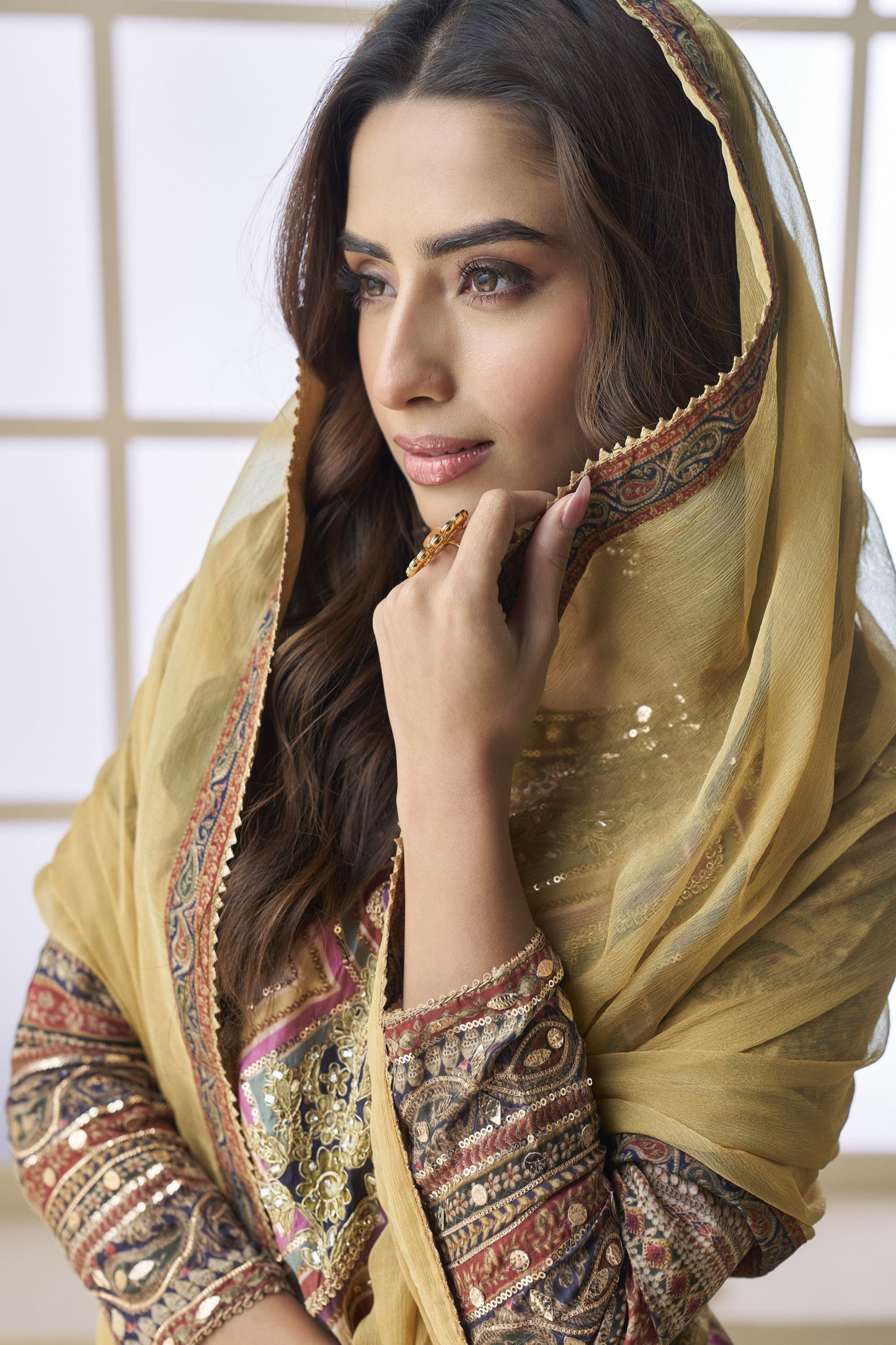 Light yellow color palazzo suit in viscose fabric with hand zari and embellished work, bringing a soft, radiant elegance to festive and special occasions.
