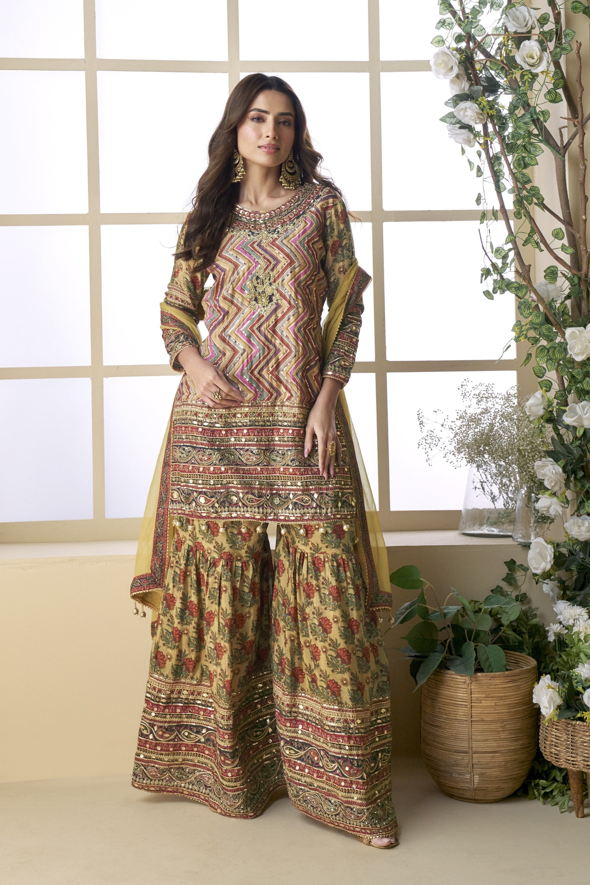 Light yellow color palazzo suit in viscose fabric with hand zari and embellished work, bringing a soft, radiant elegance to festive and special occasions.
