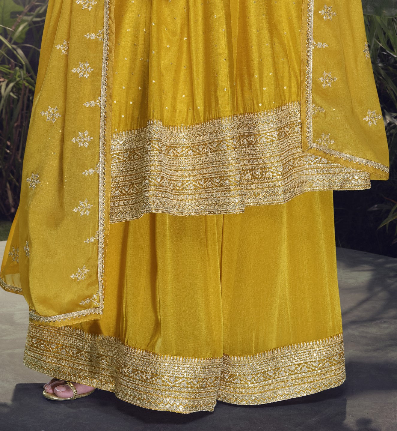 Yellow color Anarkali gown in pure viscose silk with embroidery work, combining brightness and elegance for a festive-ready look.
