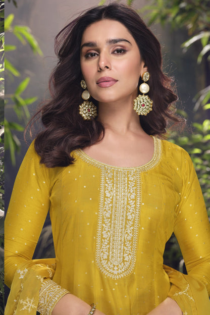 Yellow color Anarkali gown in pure viscose silk with embroidery work, combining brightness and elegance for a festive-ready look.
