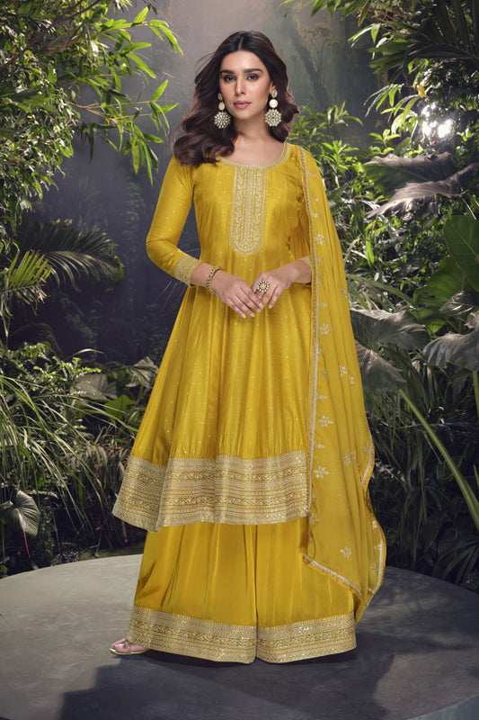 Yellow color Anarkali gown in pure viscose silk with embroidery work, combining brightness and elegance for a festive-ready look.
