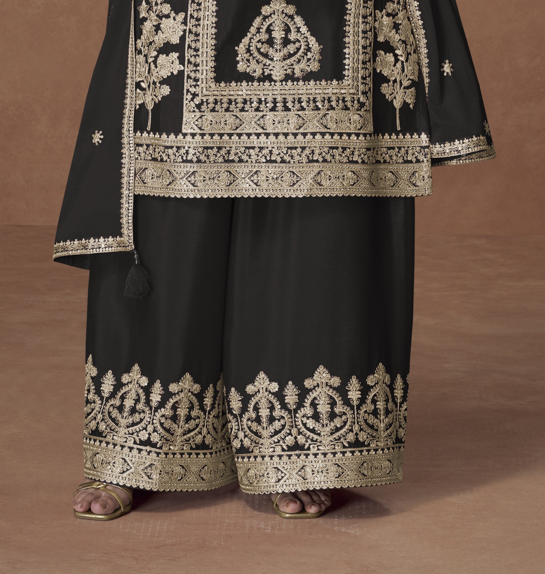Black color palazzo suit with embroidery work, featuring timeless elegance and classic charm perfect for festive and evening occasions.
