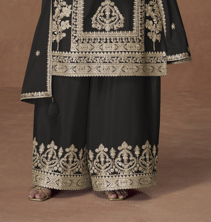 Black color palazzo suit with embroidery work, featuring timeless elegance and classic charm perfect for festive and evening occasions.
