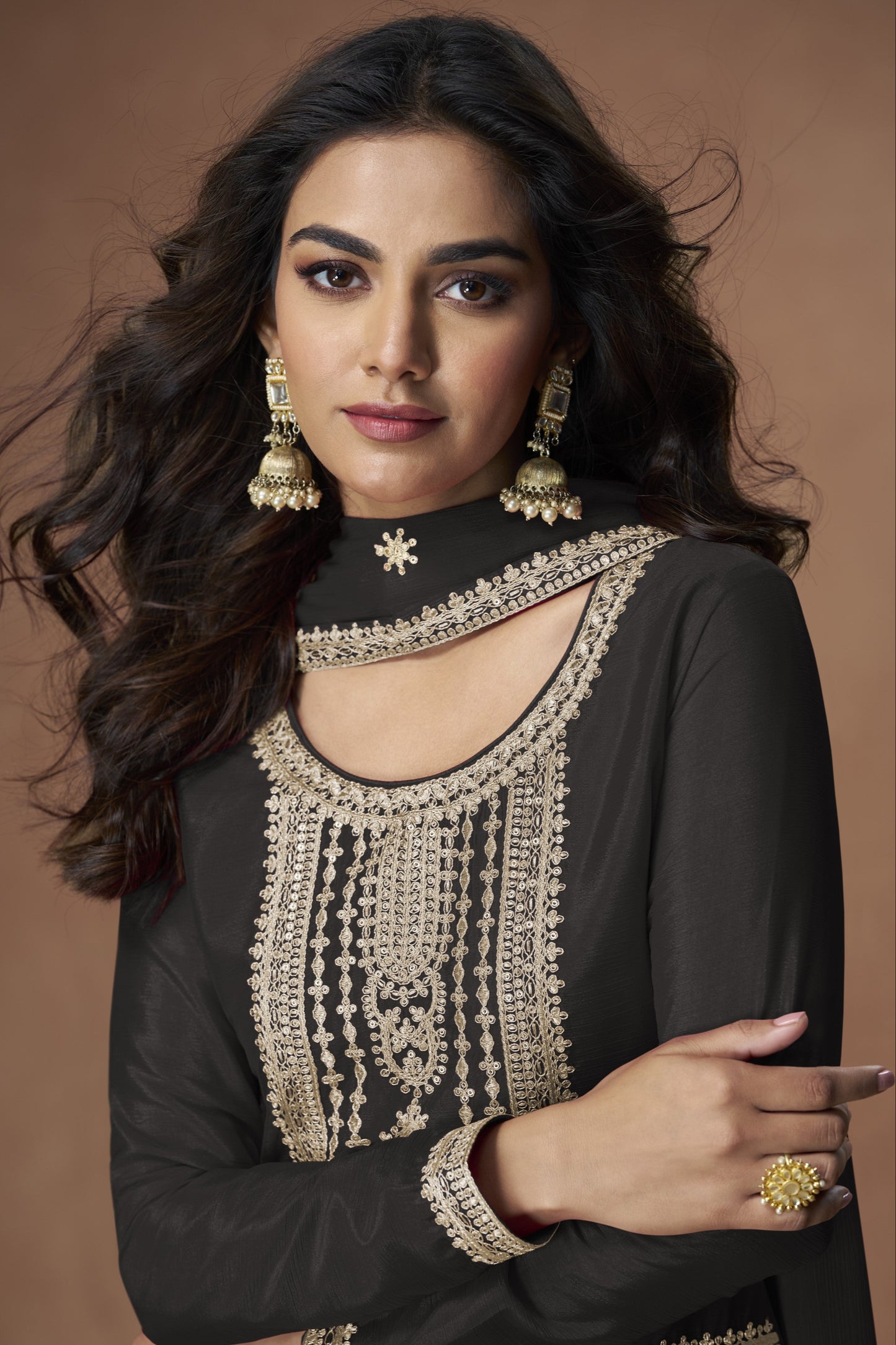 Black color palazzo suit with embroidery work, featuring timeless elegance and classic charm perfect for festive and evening occasions.
