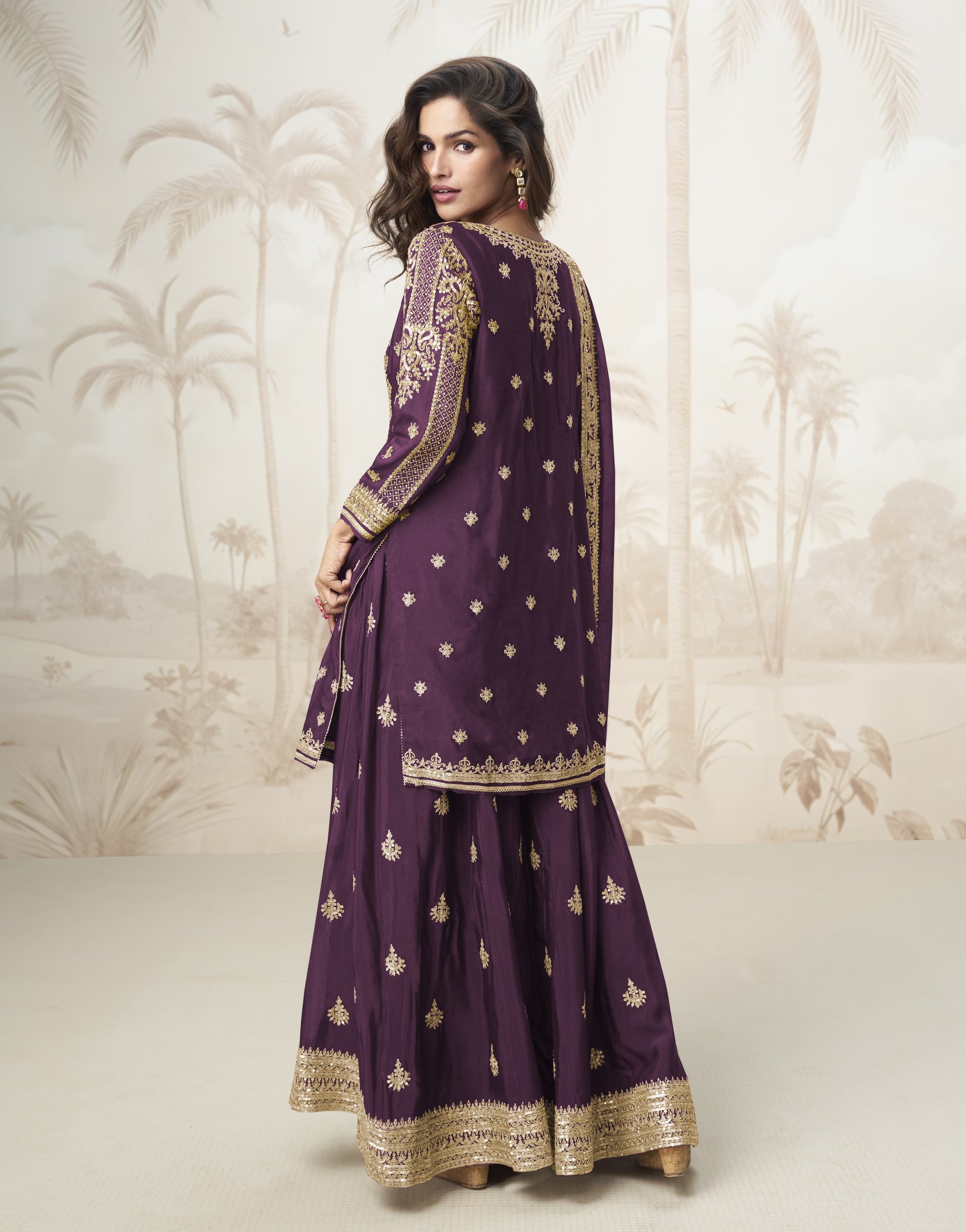 Wine color palazzo suit with embroidery work, exuding rich elegance and timeless charm, perfect for festive celebrations and special occasions.
