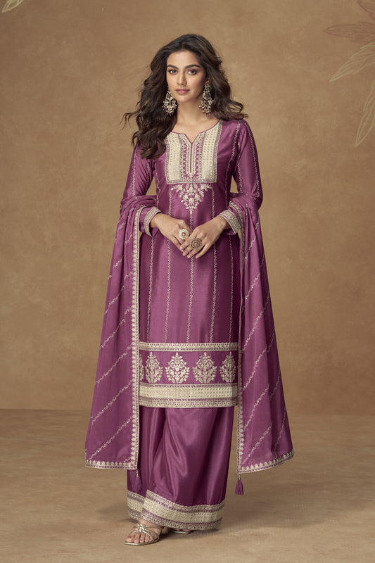 Dark pink color palazzo suit with embroidery work, offering a bold and vibrant look ideal for festive and special occasions.
