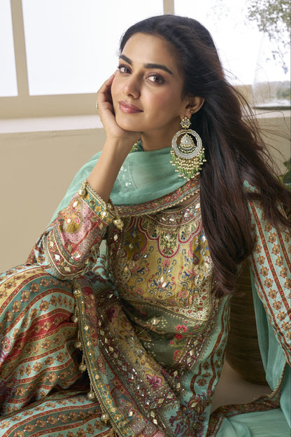Palazzo suit in viscose fabric with hand zari and embellished work, offering a rich and elegant look ideal for festive and traditional occasions.
