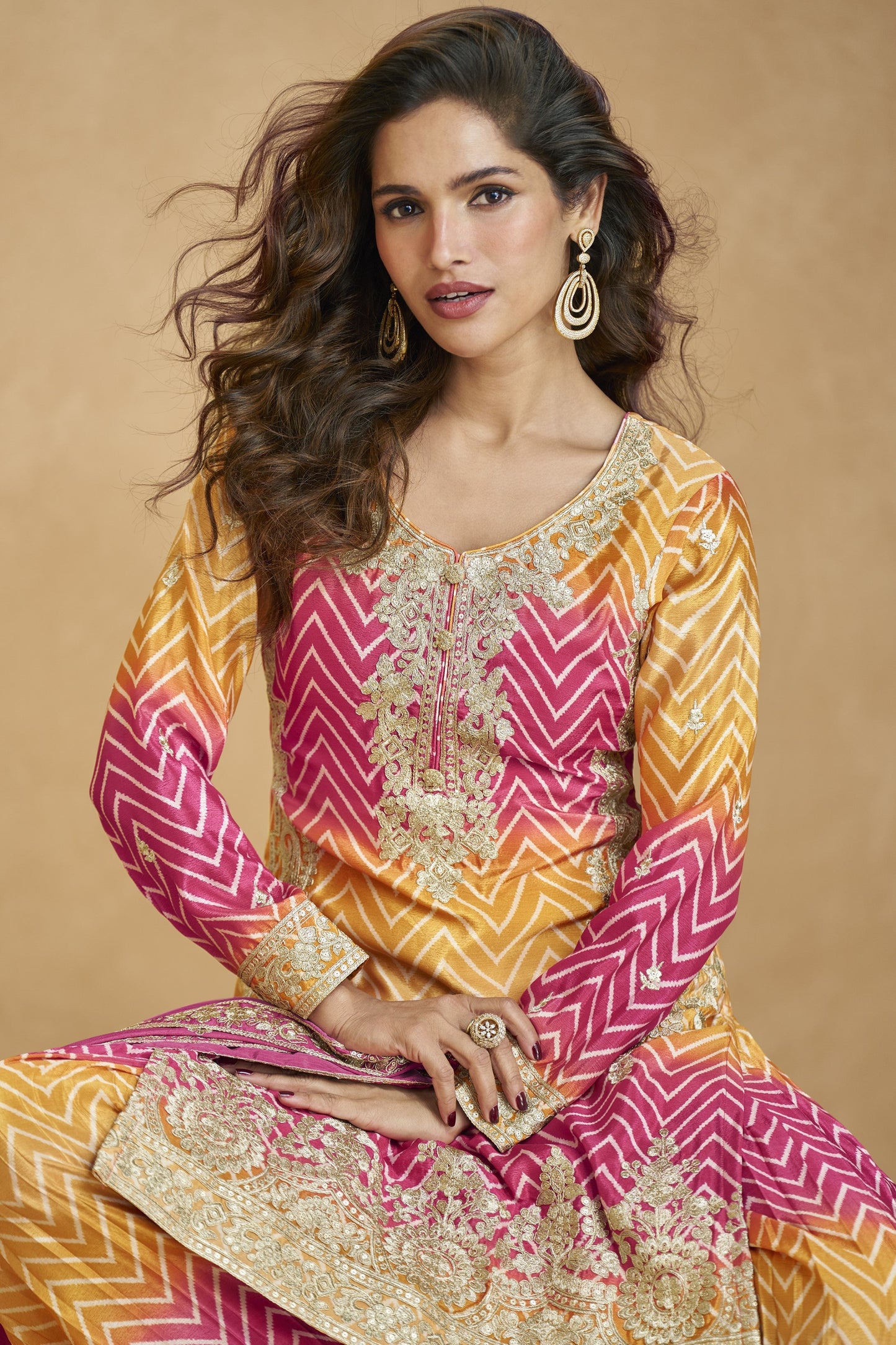 Lovely pink and yellow outfit with vibrant tones, perfect for festive celebrations, haldi functions, and cheerful occasions.
