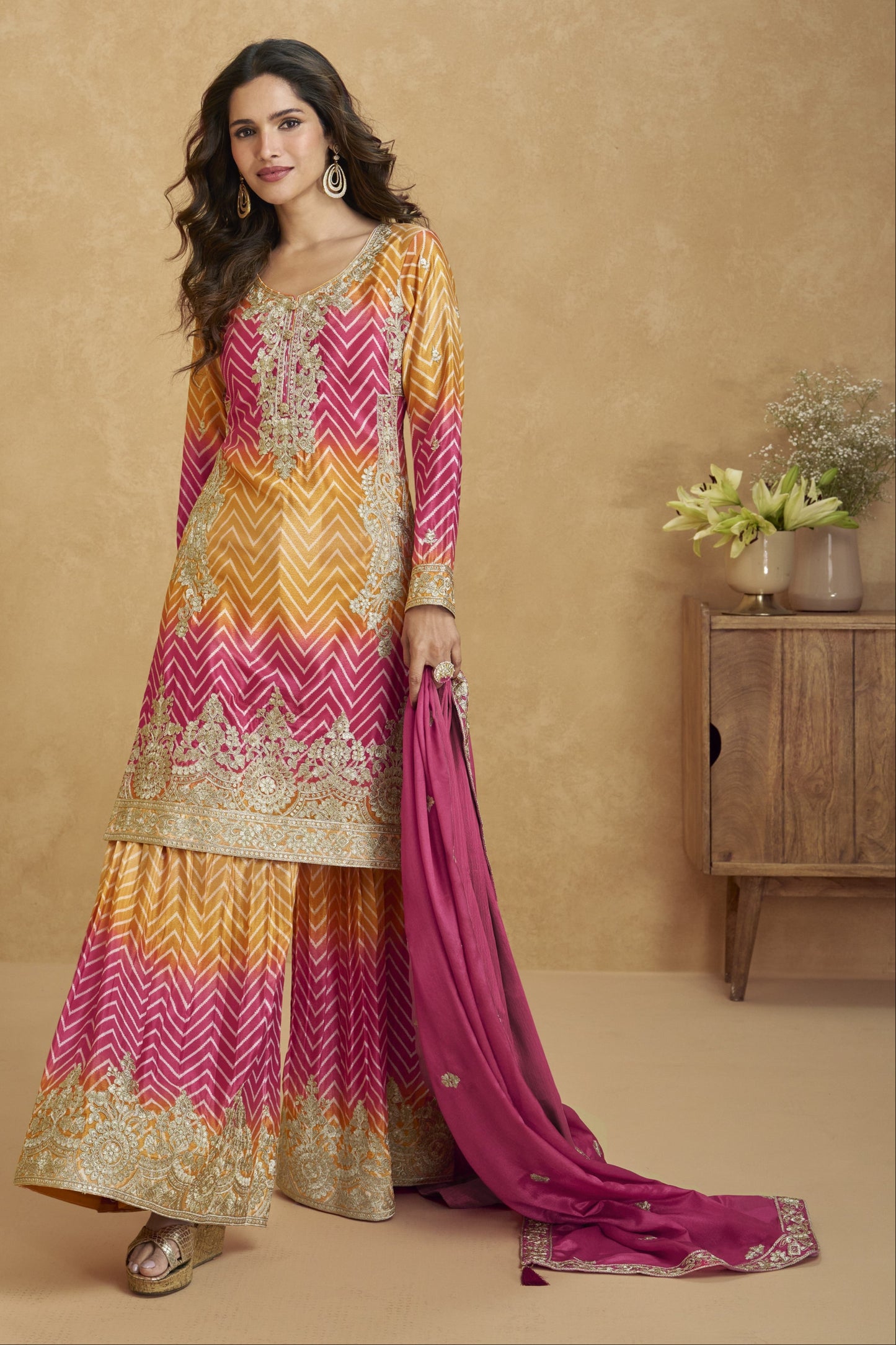 Lovely pink and yellow outfit with vibrant tones, perfect for festive celebrations, haldi functions, and cheerful occasions.
