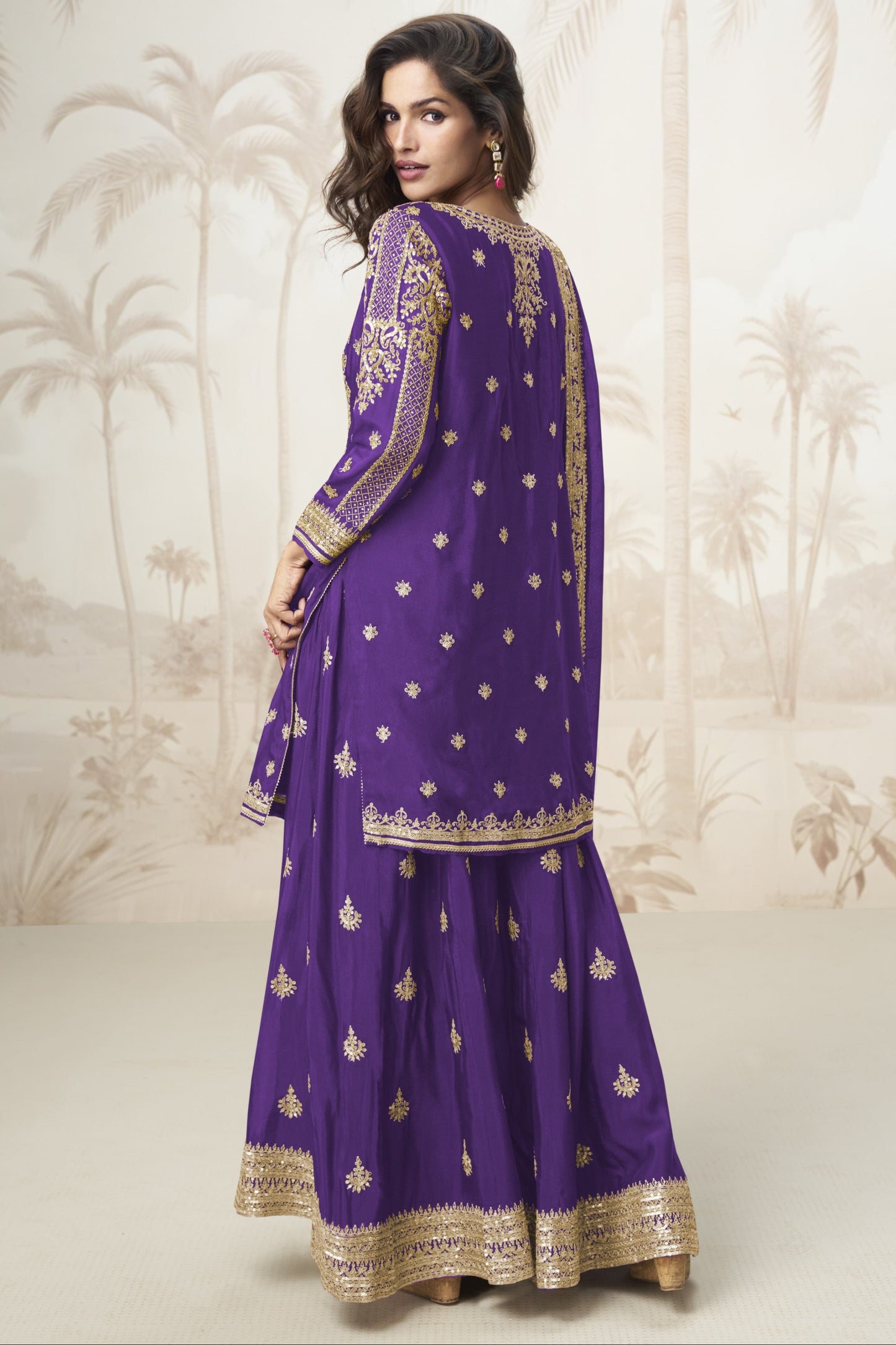 Purple color palazzo suit with embroidery work, showcasing a regal and elegant appeal ideal for festive and traditional celebrations.
