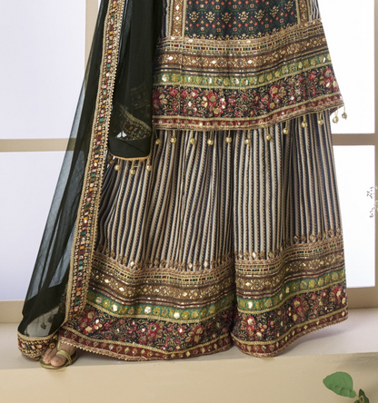 Black and grey color palazzo suit in viscose fabric with hand zari and embellished work, blending modern tones with traditional elegance for festive wear.
