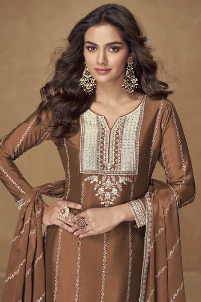 Brown color palazzo suit with embroidery work, featuring warm earthy tones and traditional detailing perfect for festive and formal occasions.

