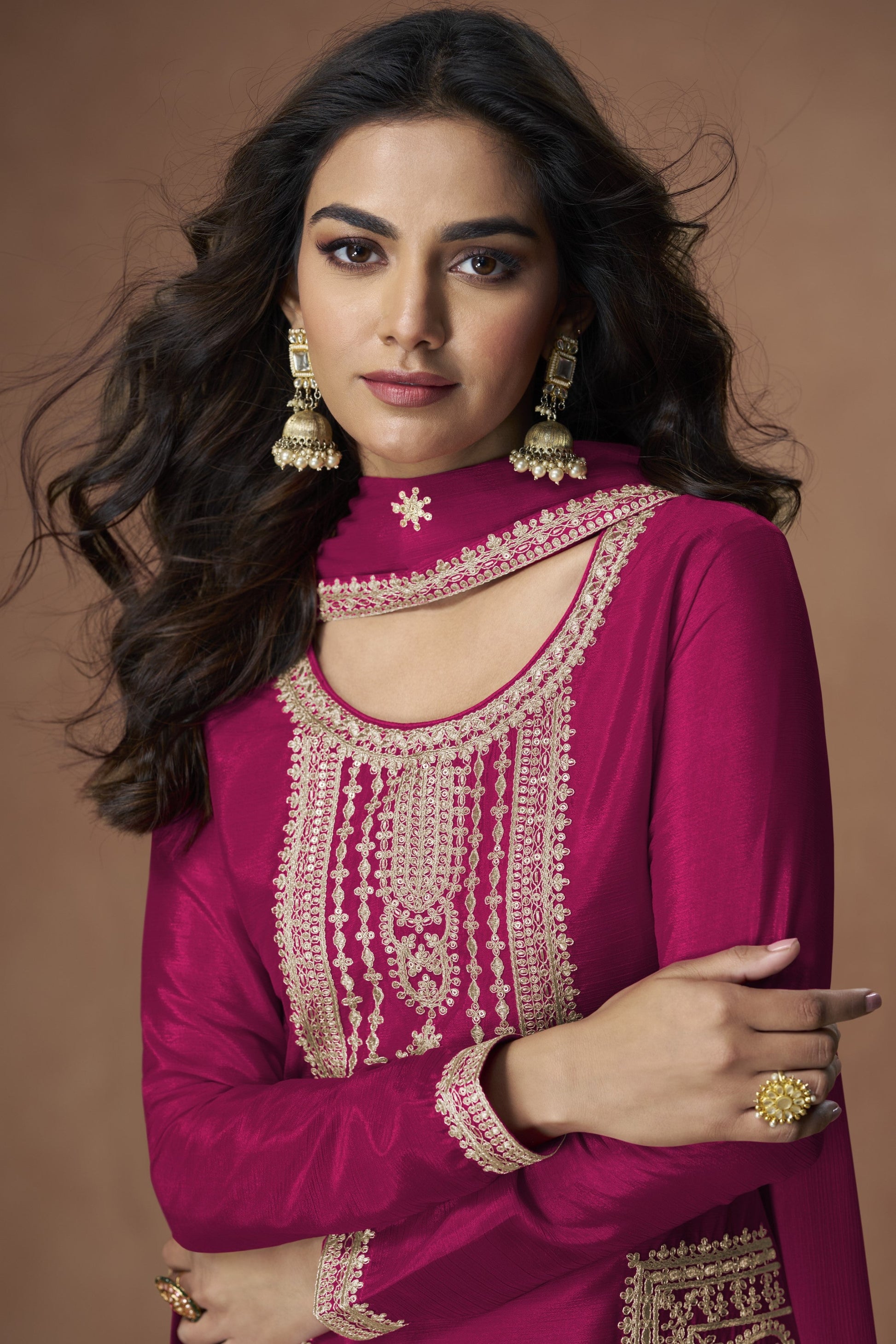 Pink color palazzo suit with embroidery work, offering a simple yet elegant look ideal for festive and traditional occasions.
