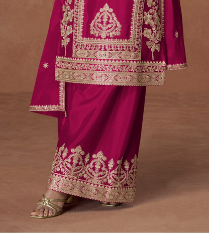 Pink color palazzo suit with embroidery work, offering a simple yet elegant look ideal for festive and traditional occasions.
