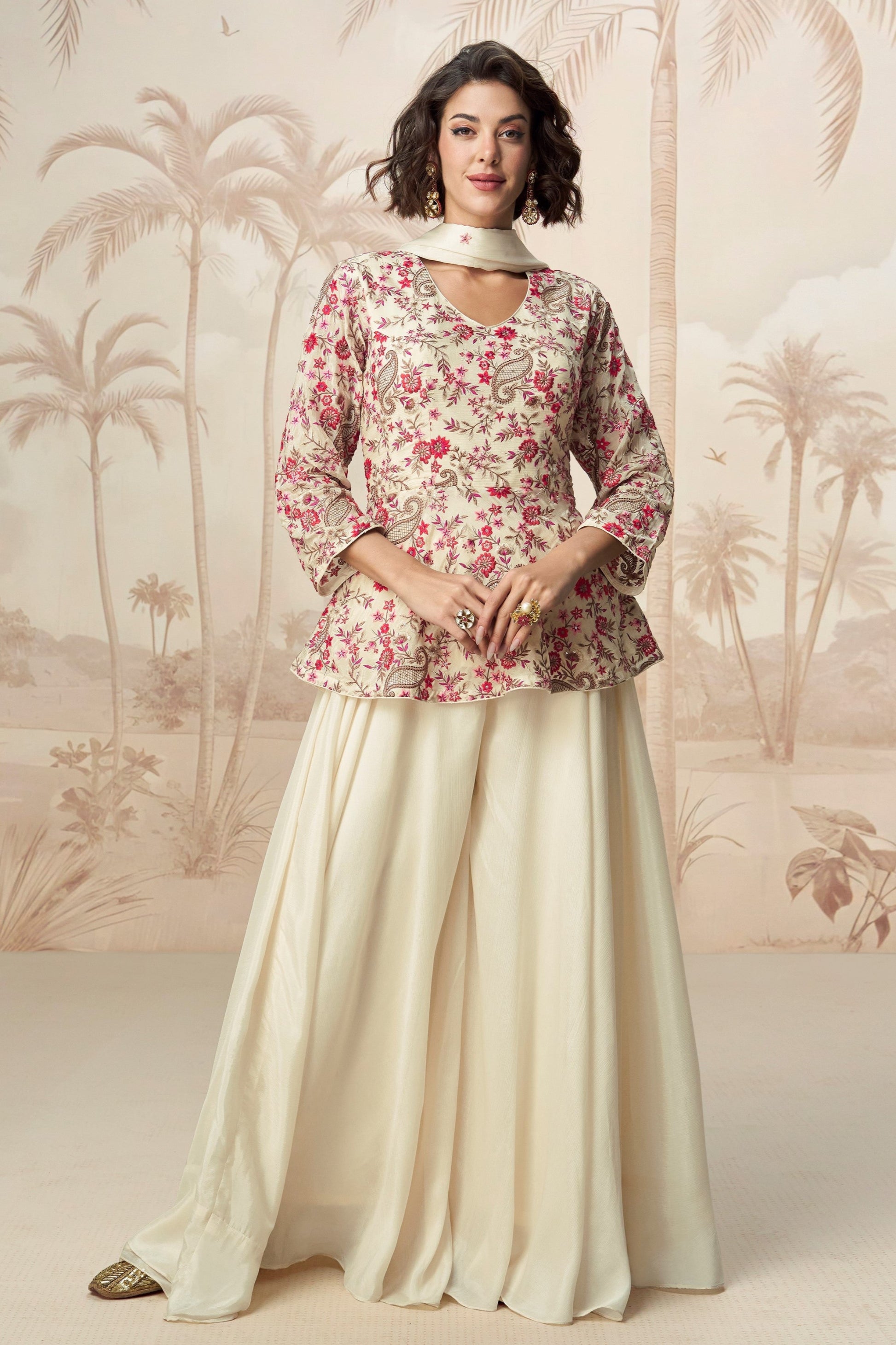 Elegant white palazzo set with soft fabric and simple design, perfect for casual wear or festive gatherings.
