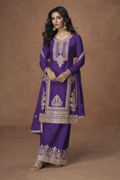 Purple color palazzo suit with embroidery work, offering a regal and graceful look ideal for festive and traditional occasions.
