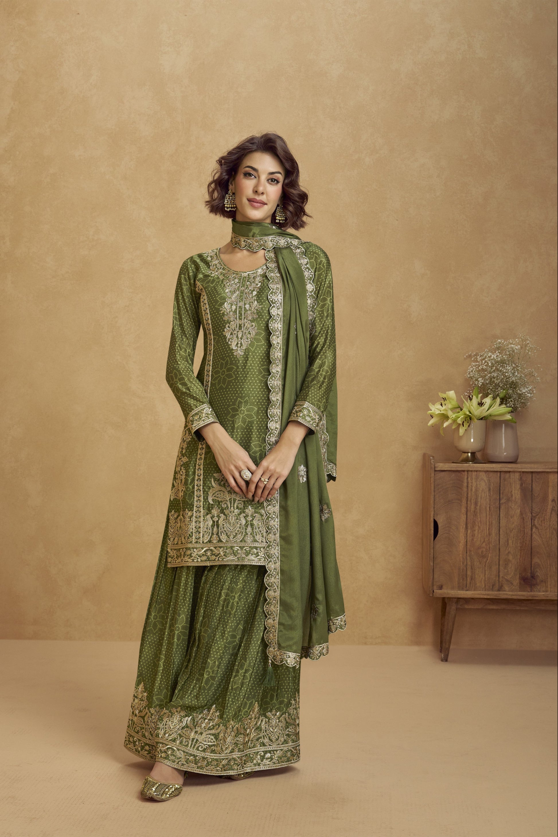 Elegant dark green outfit with a royal touch, perfect for mehndi functions, evening parties, and festive occasions.
