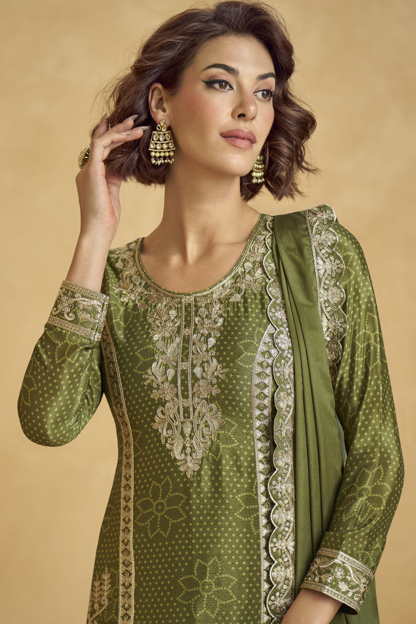 Elegant dark green outfit with a royal touch, perfect for mehndi functions, evening parties, and festive occasions.
