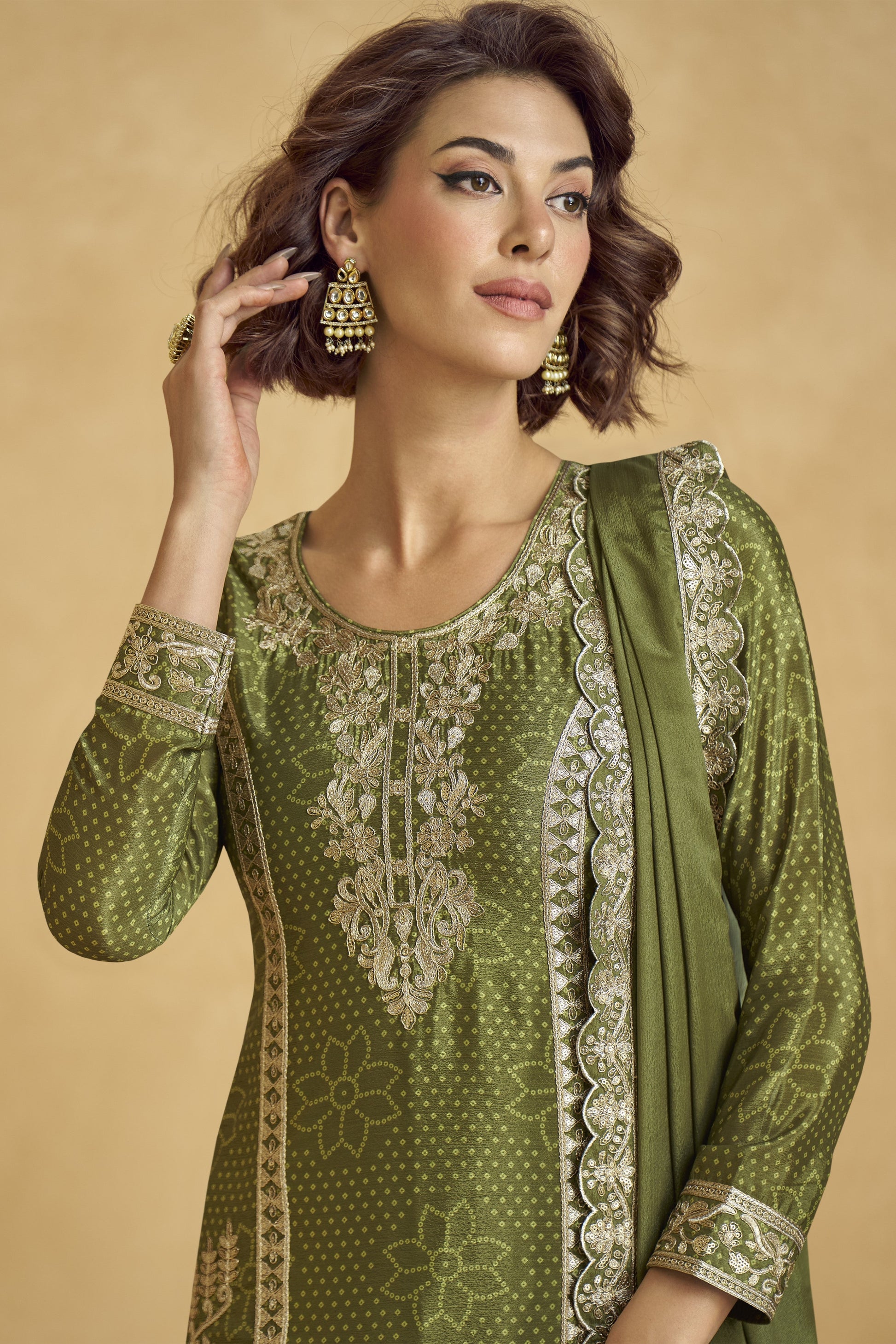 Elegant dark green outfit with a royal touch, perfect for mehndi functions, evening parties, and festive occasions.
