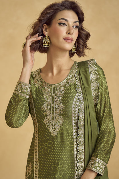 Elegant dark green outfit with a royal touch, perfect for mehndi functions, evening parties, and festive occasions.
