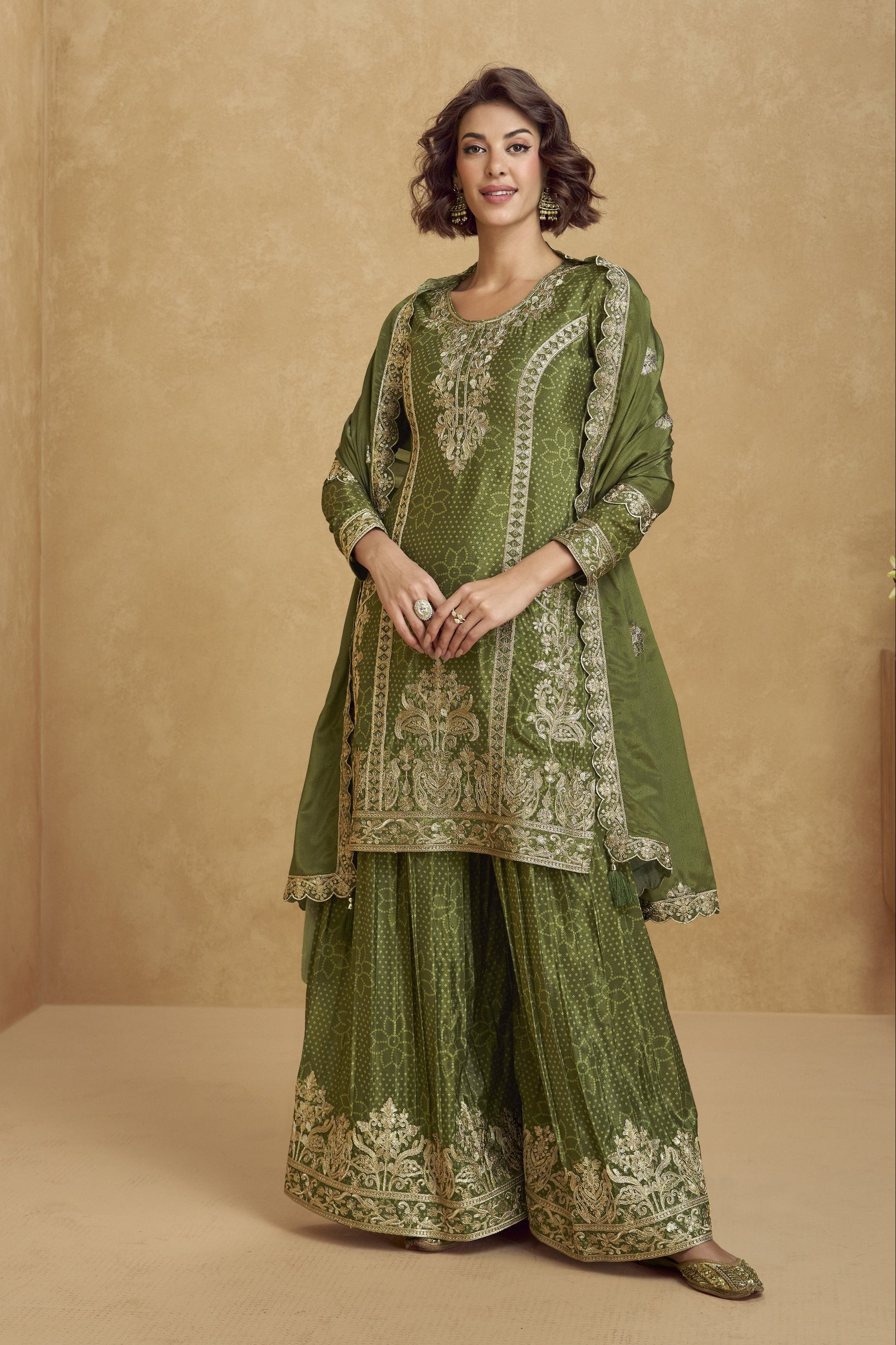 Elegant dark green outfit with a royal touch, perfect for mehndi functions, evening parties, and festive occasions.
