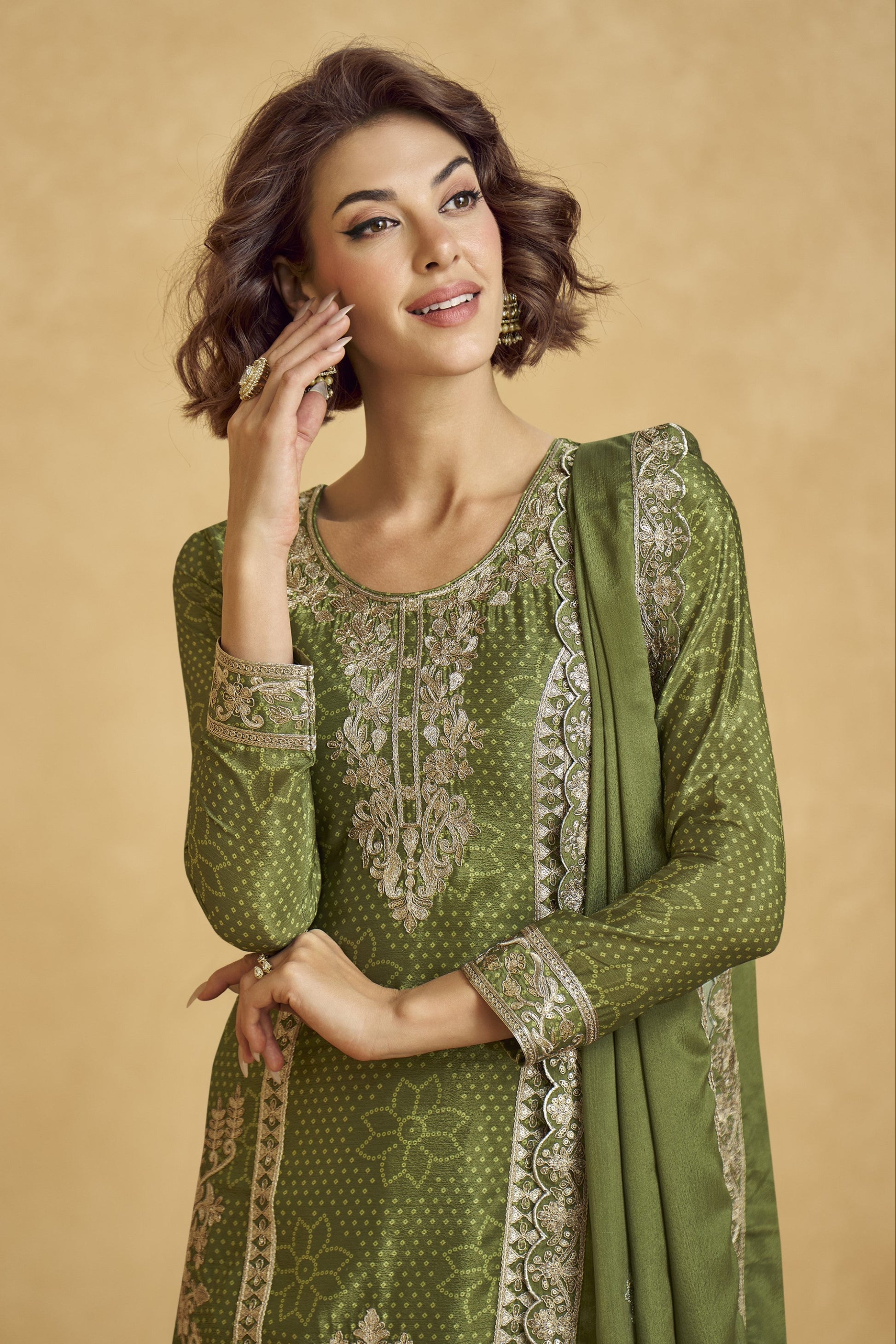 Elegant dark green outfit with a royal touch, perfect for mehndi functions, evening parties, and festive occasions.
