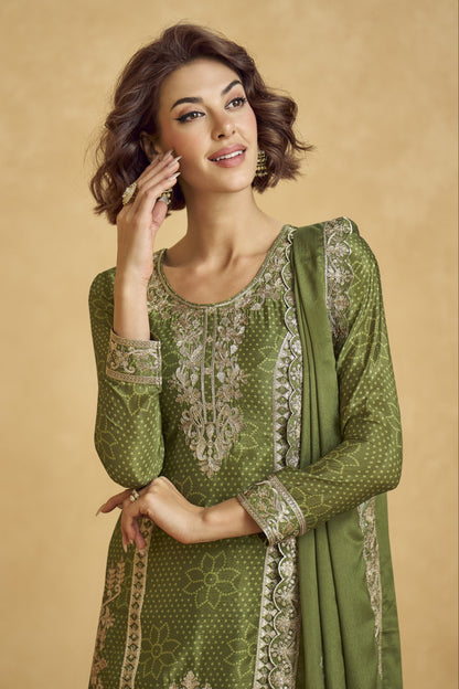 Elegant dark green outfit with a royal touch, perfect for mehndi functions, evening parties, and festive occasions.
