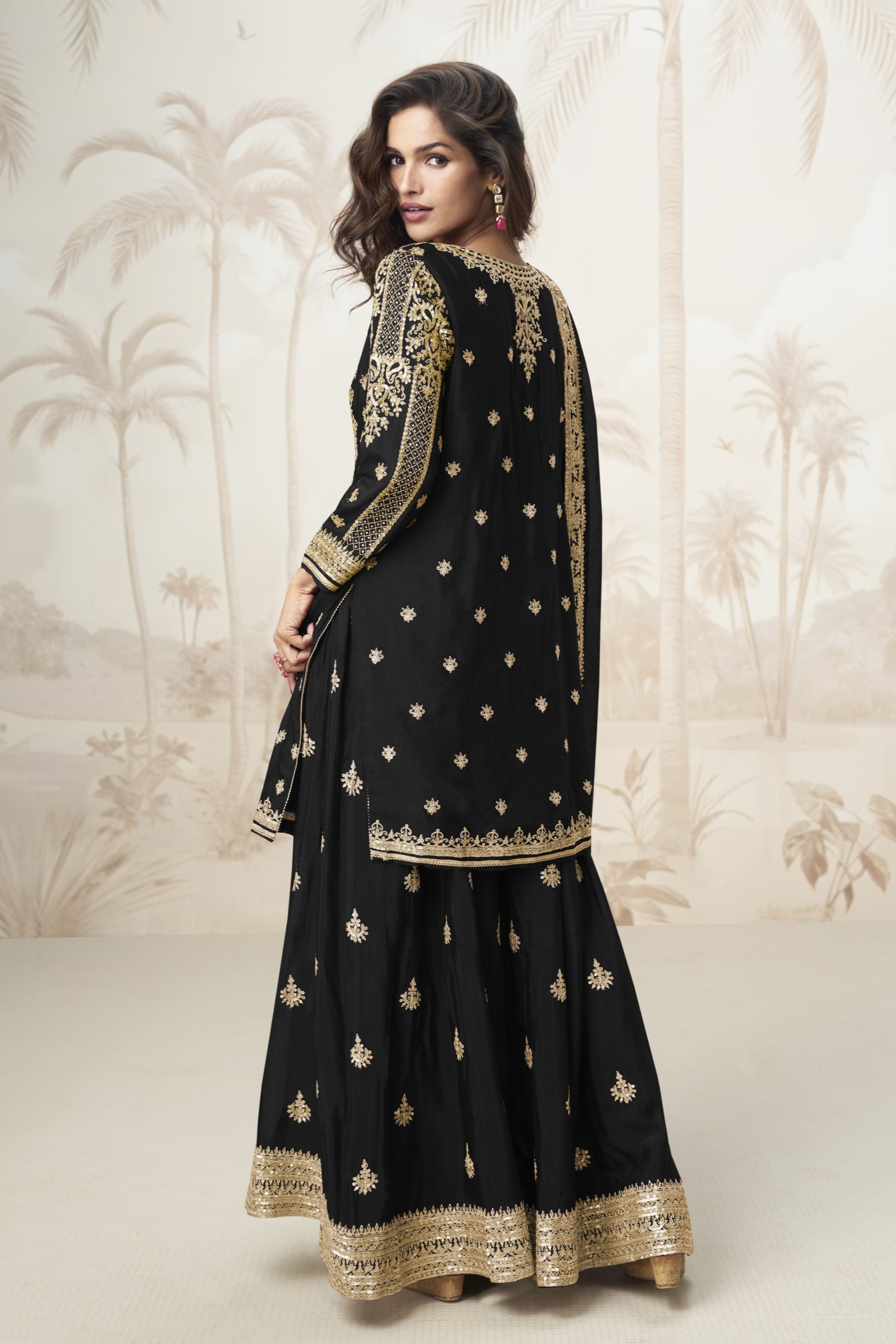 Black color palazzo suit with embroidery work, delivering a classic and elegant look perfect for festive, evening, and formal occasions.
