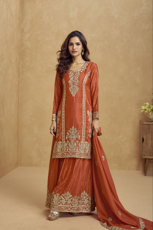 Rich dark orange outfit with bold traditional charm, ideal for festive functions, mehndi nights, and cultural celebrations.
