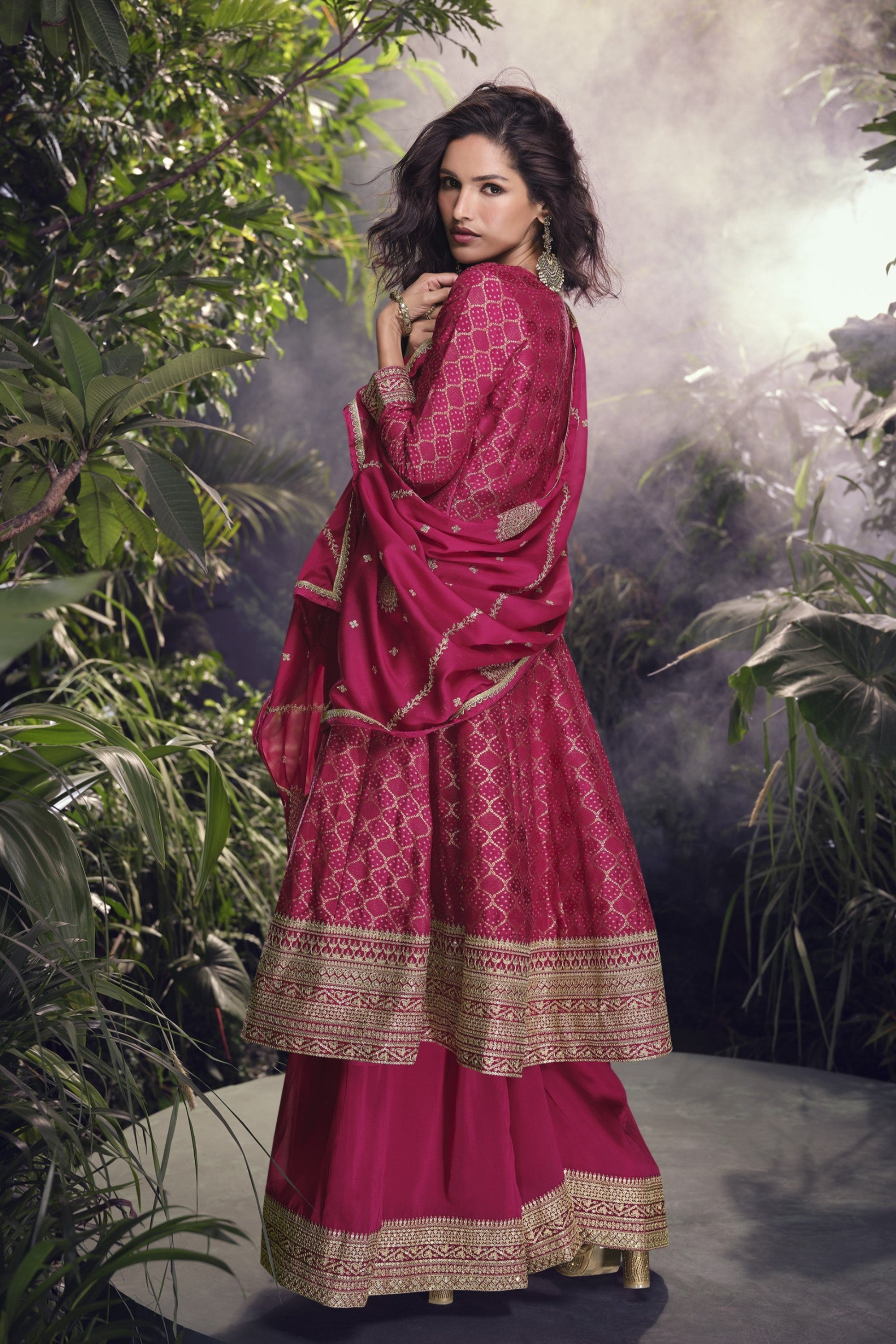 Pink color Anarkali gown in pure viscose silk with embroidery work, offering a graceful and refined look for festive and special occasions.
