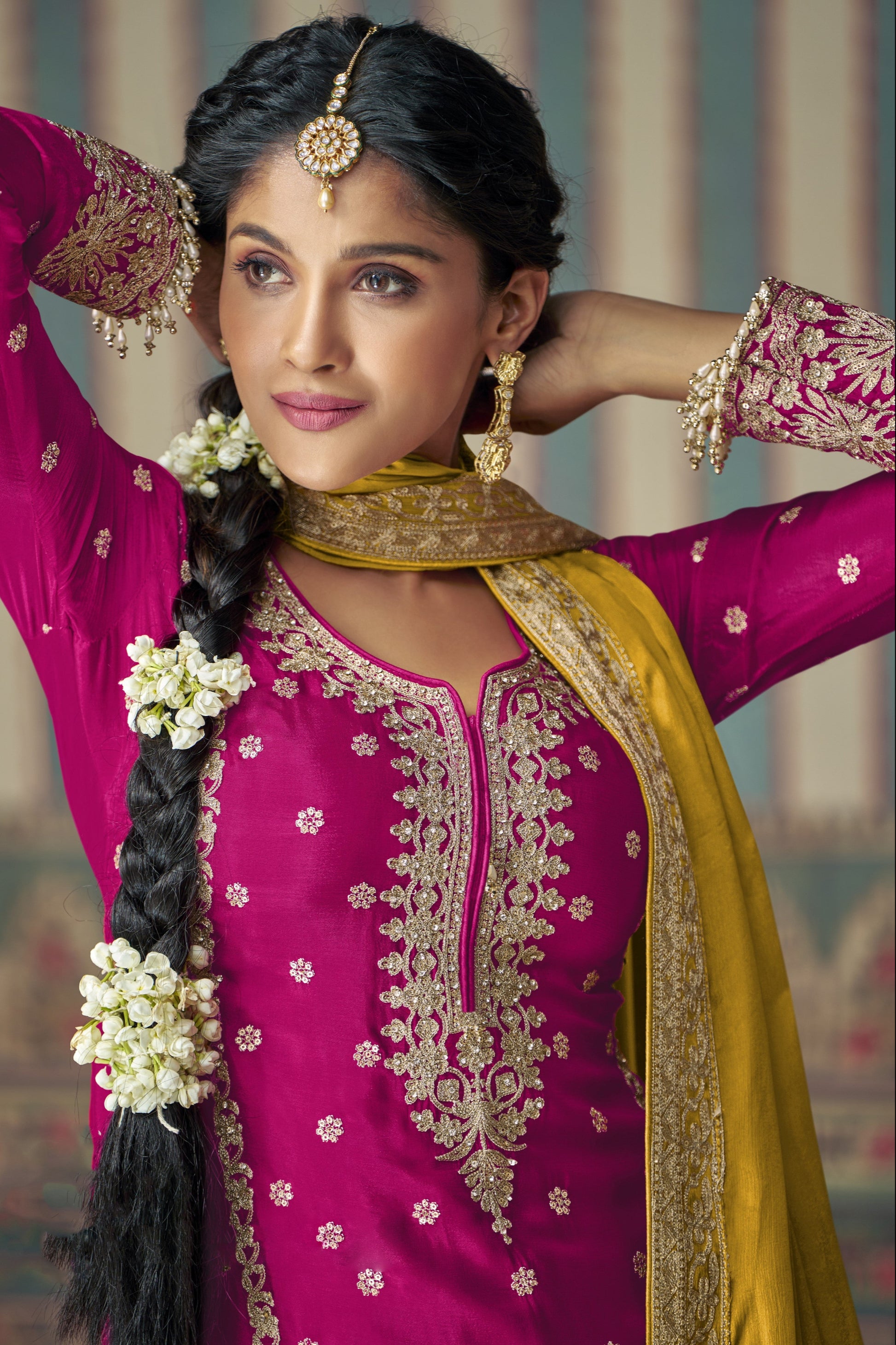 Dark pink color palazzo suit in Chinon silk fabric with embroidery work, offering a vibrant and elegant look for festive and special occasions.
