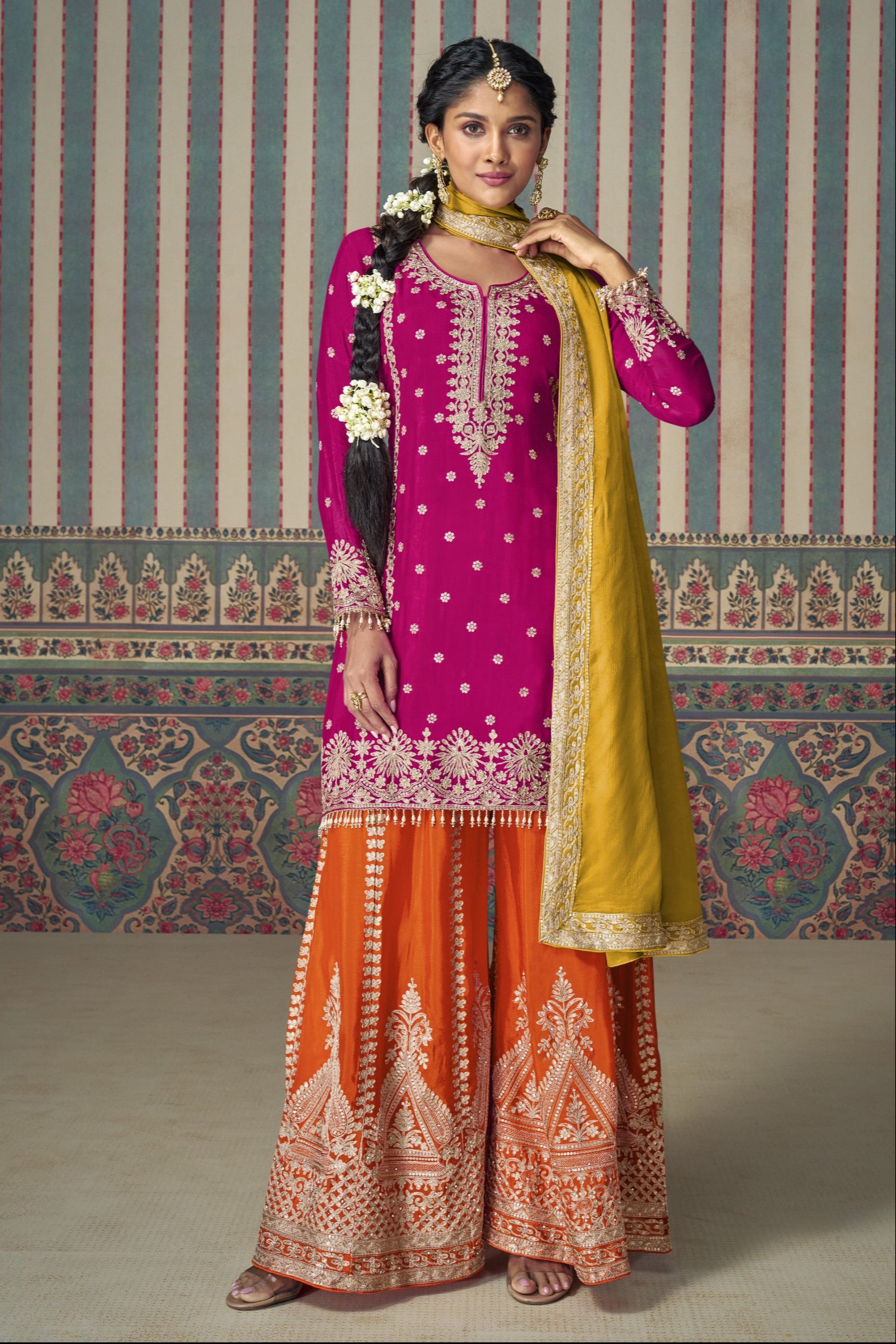 Dark pink color palazzo suit in Chinon silk fabric with embroidery work, offering a vibrant and elegant look for festive and special occasions.
