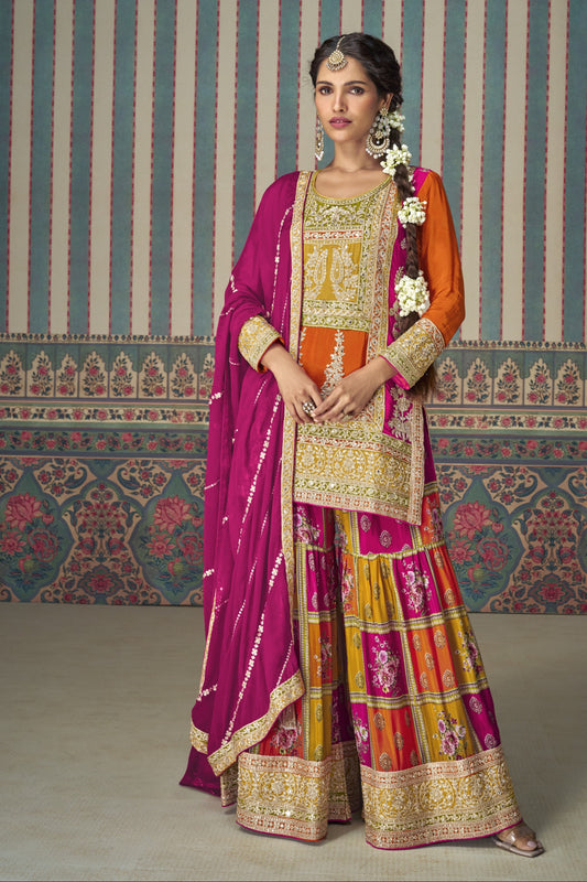 Orange color palazzo suit in Chinon silk fabric with embroidery work, radiating festive vibrance and graceful charm for special celebrations.

