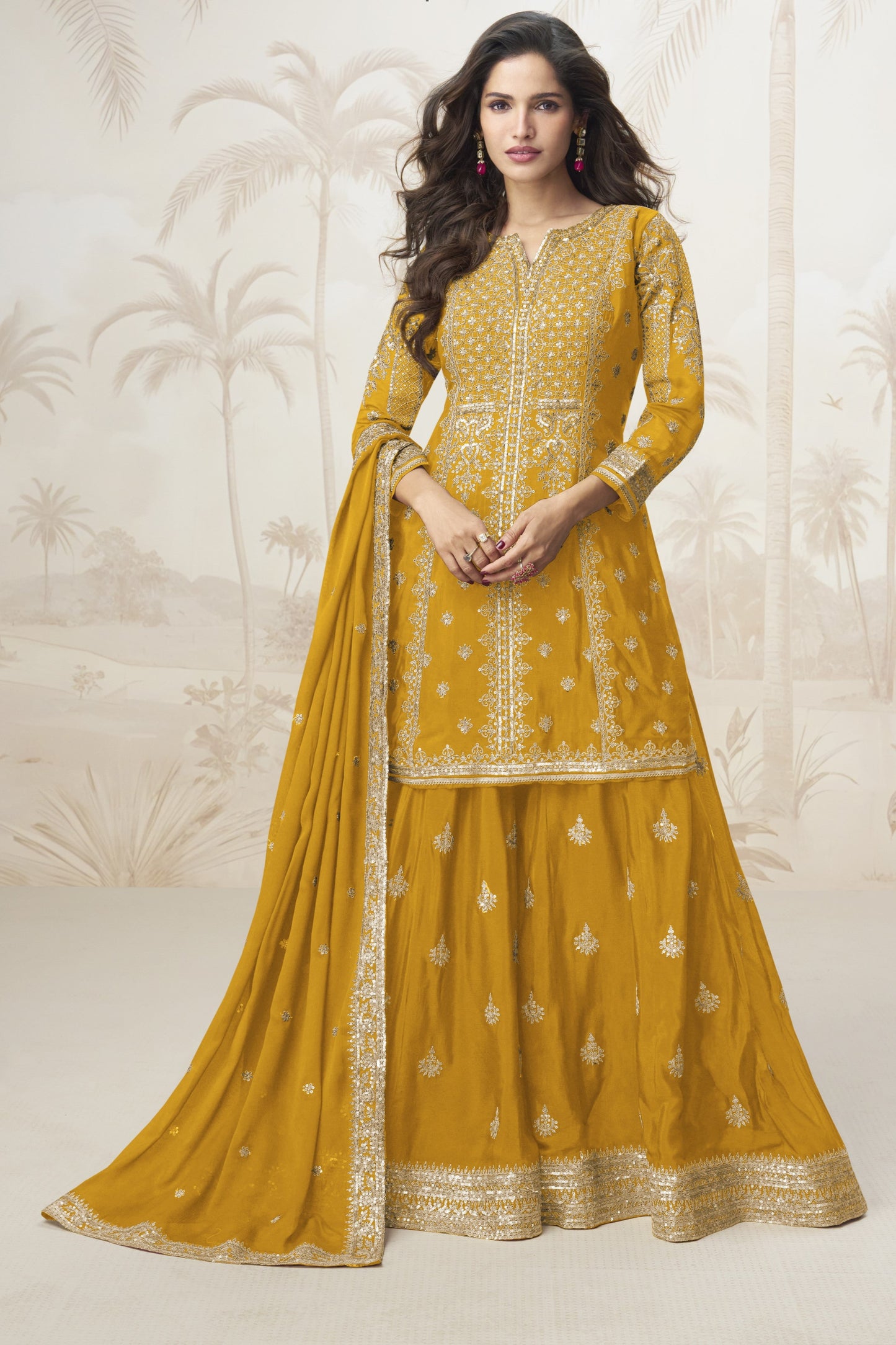 Yellow color palazzo suit with embroidery work, radiating cheerful elegance and festive charm, perfect for traditional occasions and celebrations.
