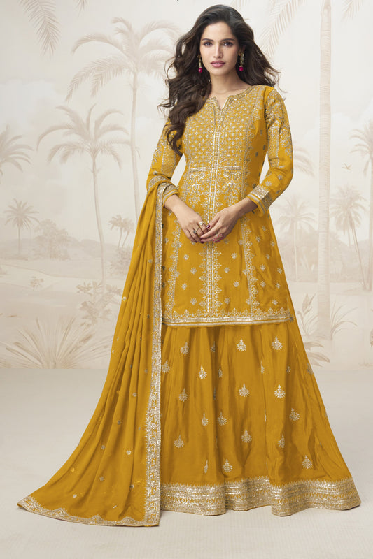 Yellow color palazzo suit with embroidery work, radiating cheerful elegance and festive charm, perfect for traditional occasions and celebrations.
