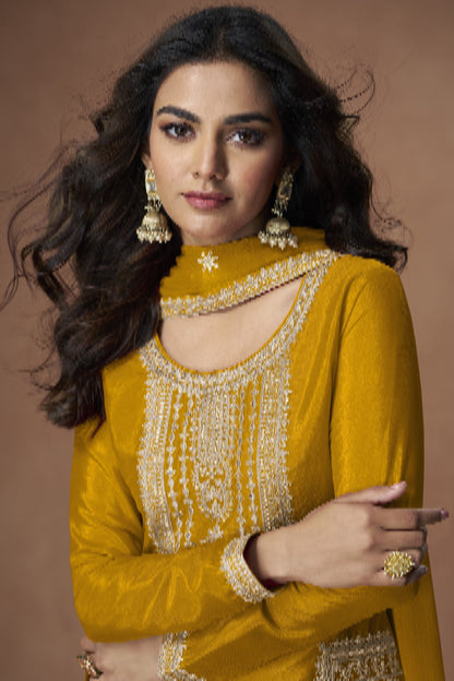 Yellow color palazzo suit with embroidery work, radiating bright and joyful elegance perfect for festive and cultural celebrations.
