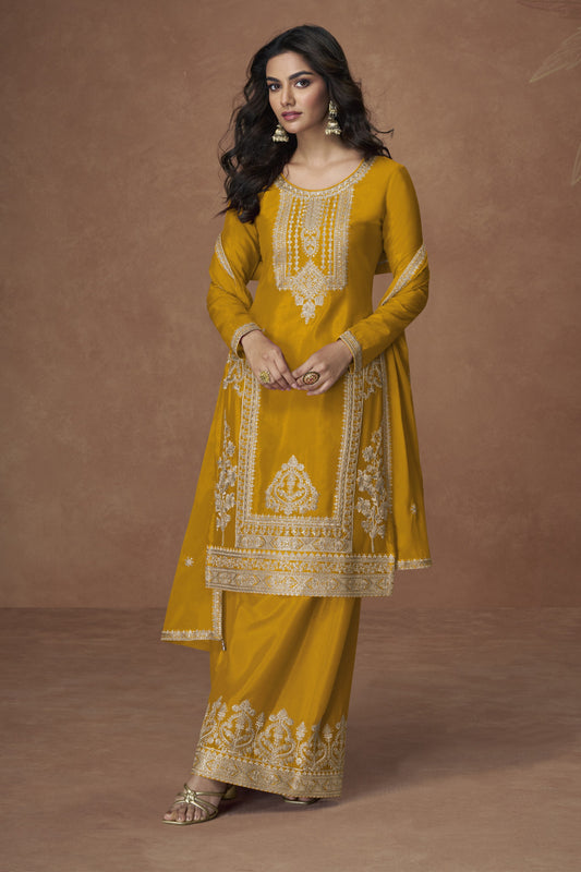 Yellow color palazzo suit with embroidery work, radiating bright and joyful elegance perfect for festive and cultural celebrations.
