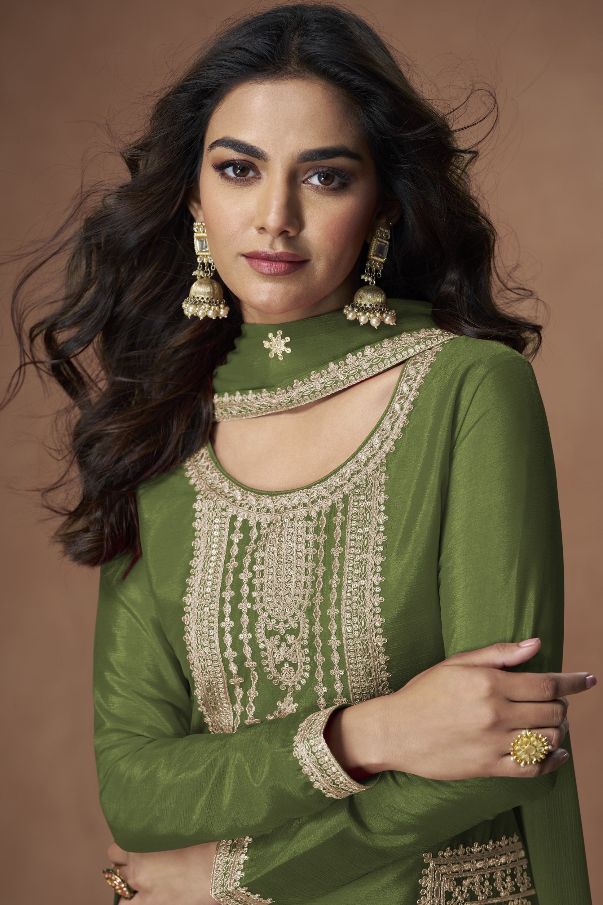 Dark green color palazzo suit with embroidery work, showcasing a rich and elegant look perfect for festive and cultural celebrations.
