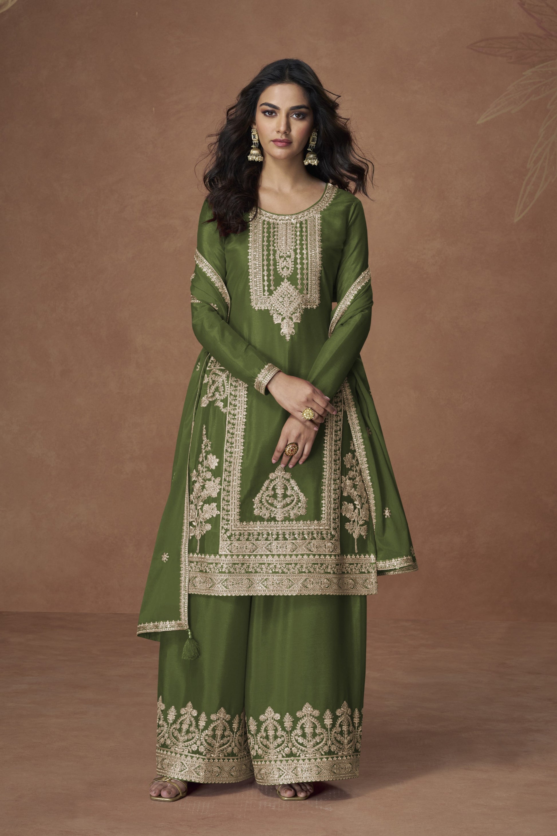 Dark green color palazzo suit with embroidery work, showcasing a rich and elegant look perfect for festive and cultural celebrations.
