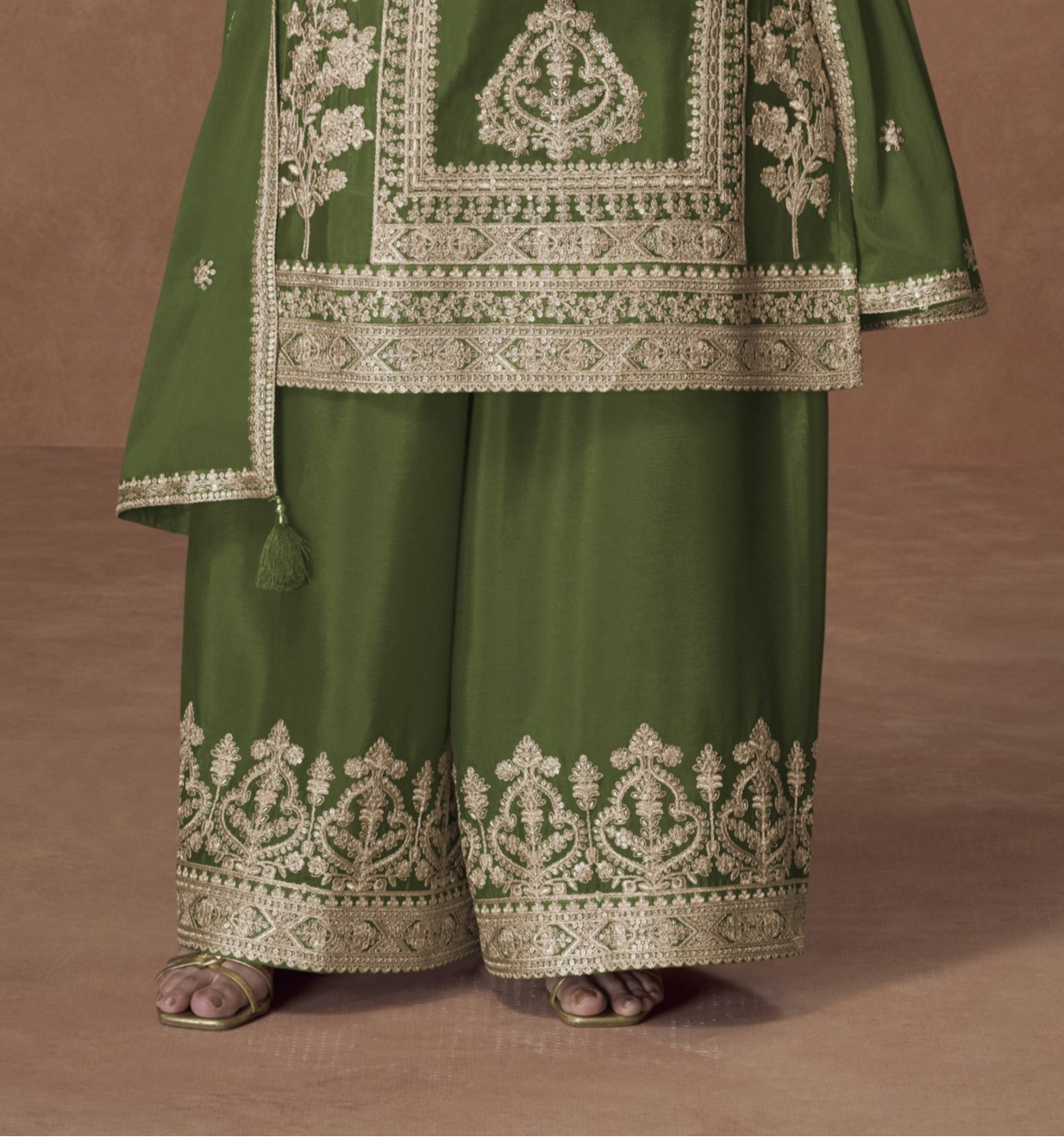Dark green color palazzo suit with embroidery work, showcasing a rich and elegant look perfect for festive and cultural celebrations.
