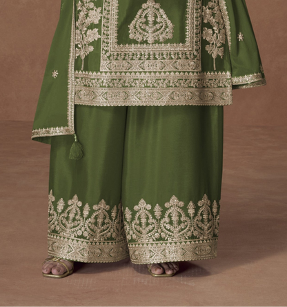 Dark green color palazzo suit with embroidery work, showcasing a rich and elegant look perfect for festive and cultural celebrations.
