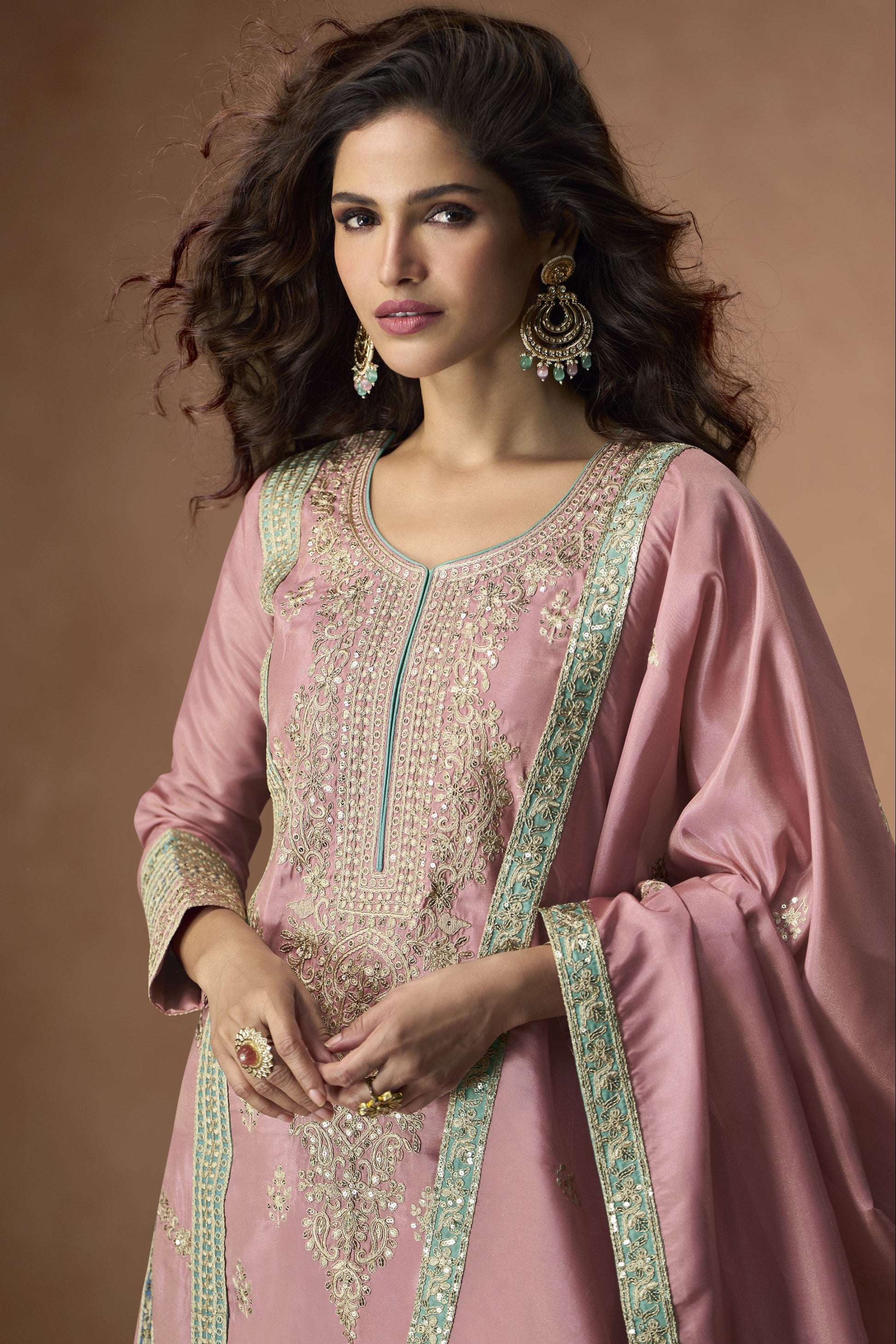 Graceful rose gold outfit with a touch of shimmer, perfect for weddings, receptions, and elegant evening events.
