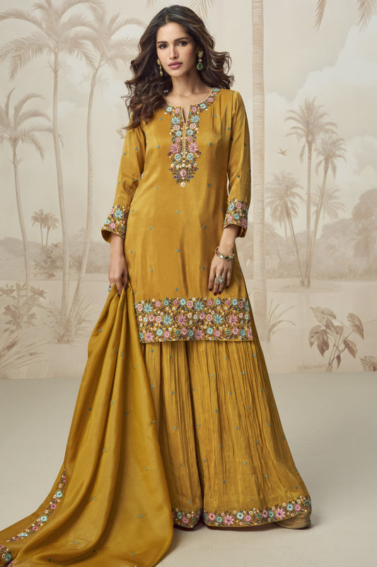 yellow Plazzo for a Sangeet – Shiny and glamorous, made to sparkle on the dance floor.
