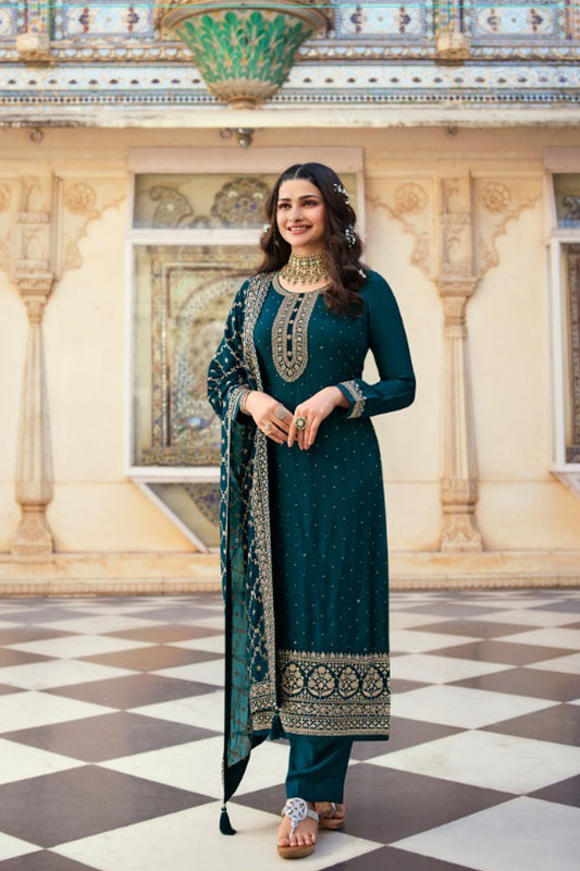 Teal salwar kameez is cool and refreshing. It blends blue and green for a unique look