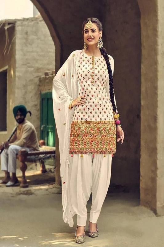 White salwar kameez is pure and classic. Ivory with embroidery looks soft and pretty.
